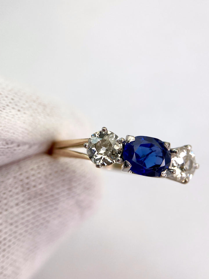 Blue 1.5 ct sapphire ring with two diamonds totaling 1.1 ct: "Rare Luck"