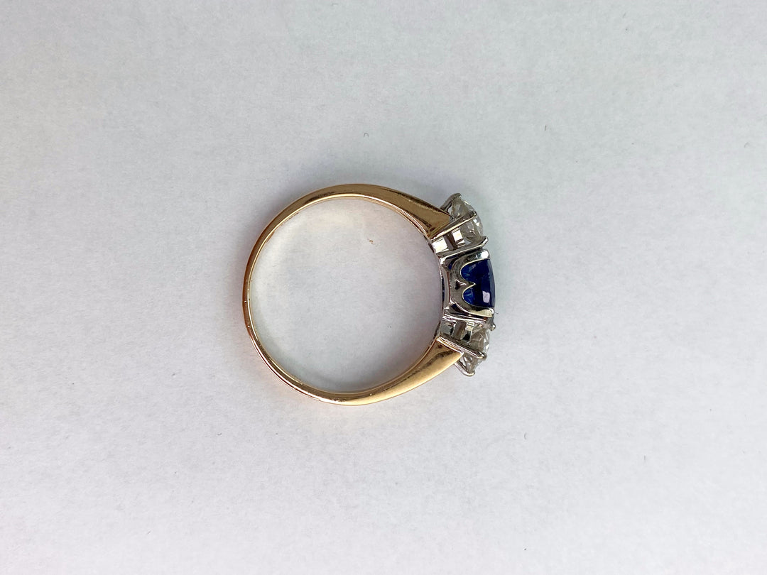 Blue 1.5 ct sapphire ring with two diamonds totaling 1.1 ct: "Rare Luck"