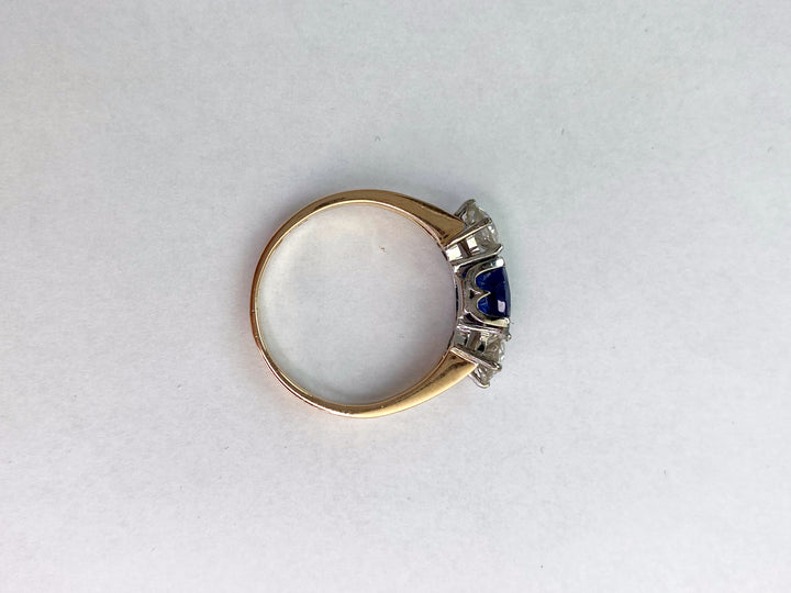 Blue 1.5 ct sapphire ring with two diamonds totaling 1.1 ct: "Rare Luck"