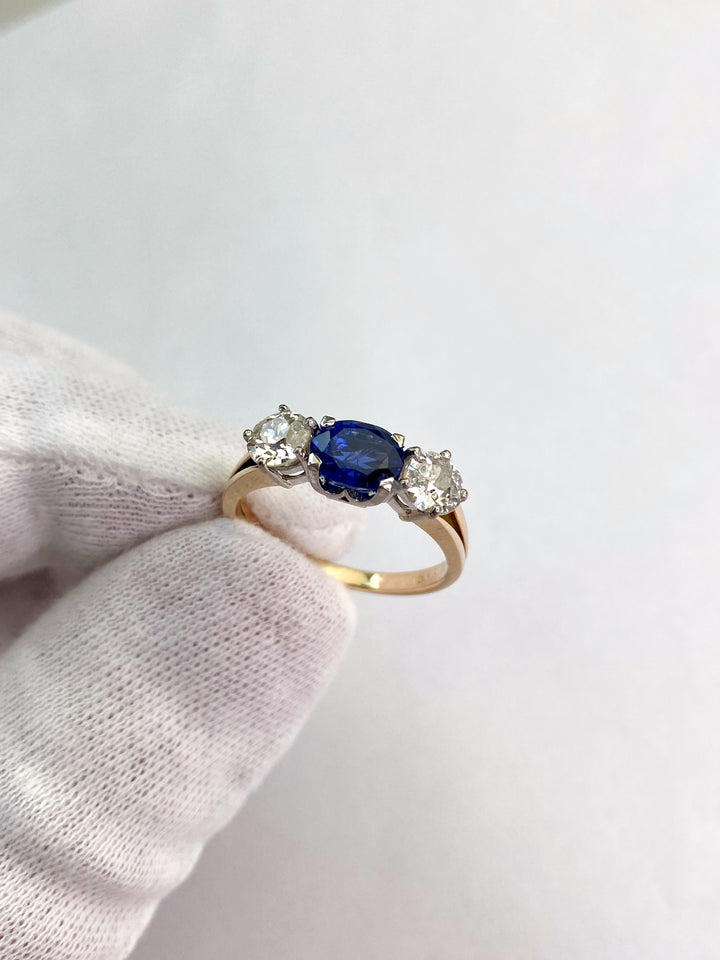 Blue 1.5 ct sapphire ring with two diamonds totaling 1.1 ct: "Rare Luck"