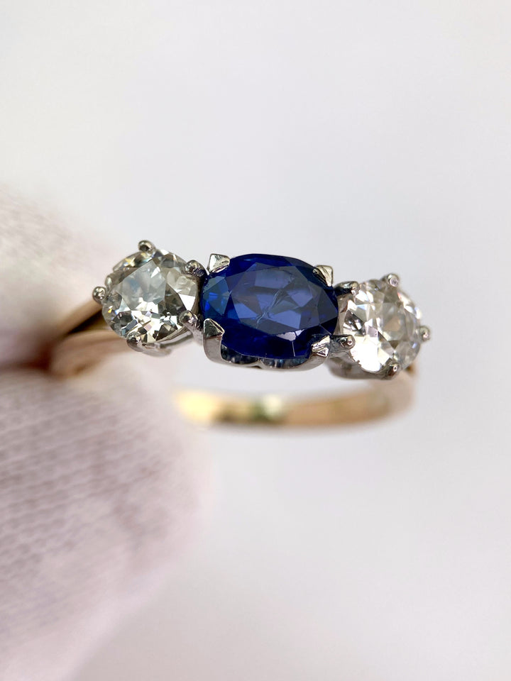 Blue 1.5 ct sapphire ring with two diamonds totaling 1.1 ct: "Rare Luck"