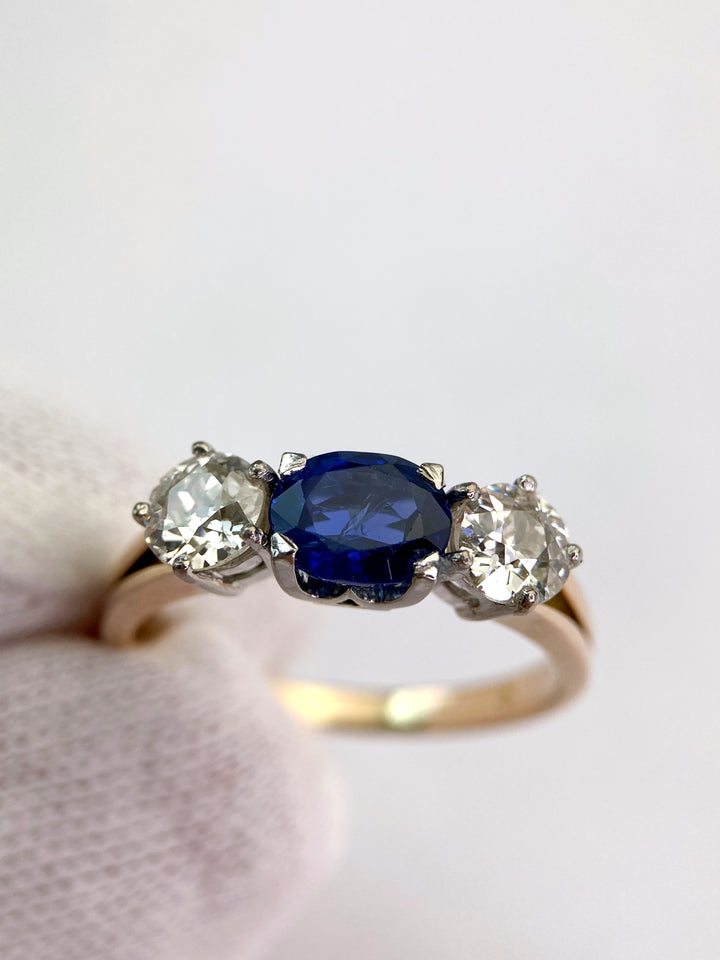 Blue 1.5 ct sapphire ring with two diamonds totaling 1.1 ct: "Rare Luck"