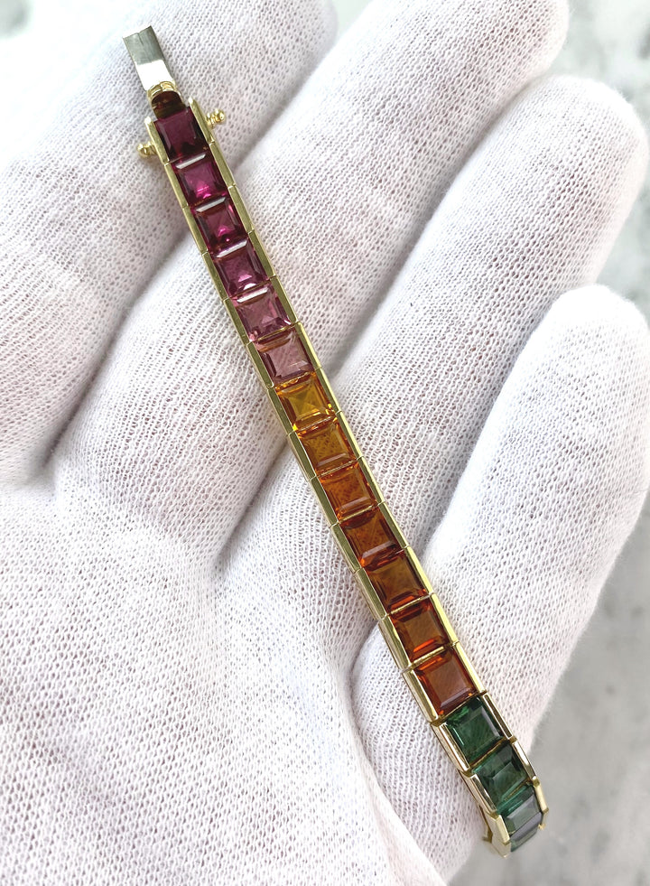 Luxurious tennis bracelet with tourmalines, citrines and topazes in gold: "Joy of the Rainbow"