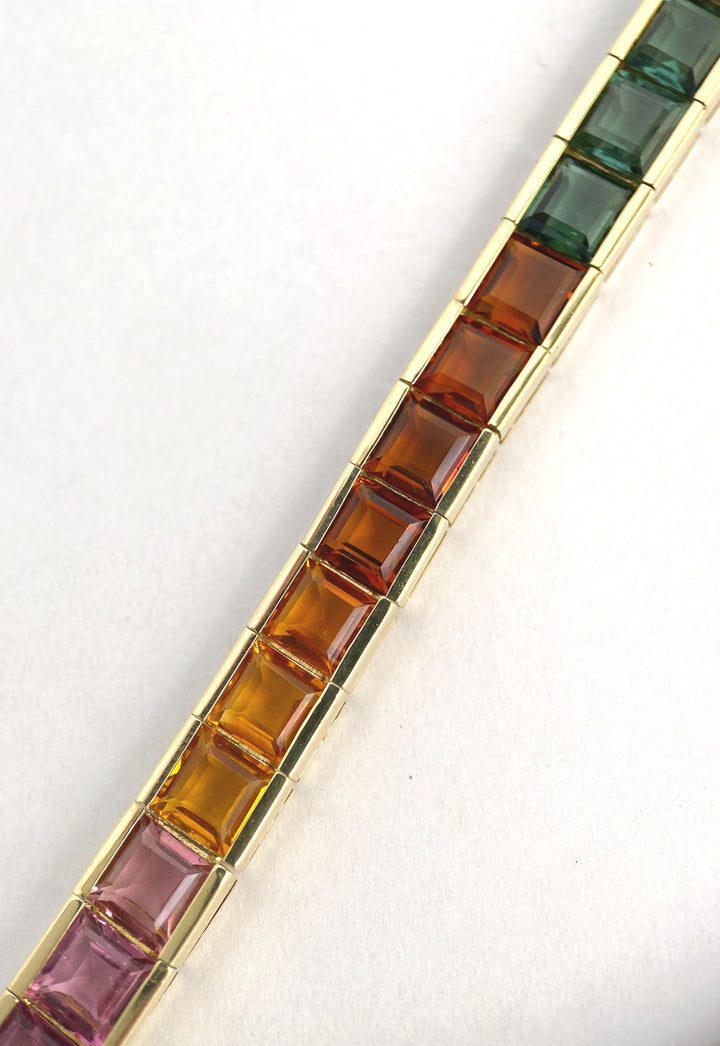 Luxurious tennis bracelet with tourmalines, citrines and topazes in gold: "Joy of the Rainbow"