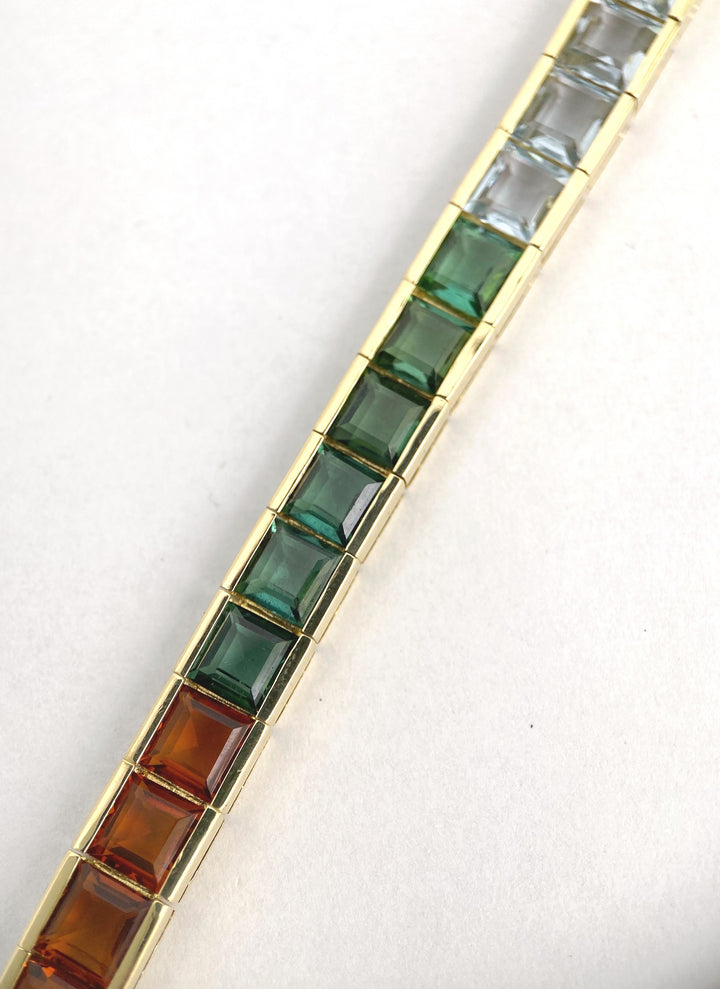 Luxurious tennis bracelet with tourmalines, citrines and topazes in gold: "Joy of the Rainbow"