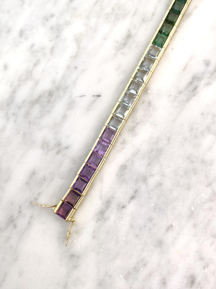 Luxurious tennis bracelet with tourmalines, citrines and topazes in gold: "Joy of the Rainbow"
