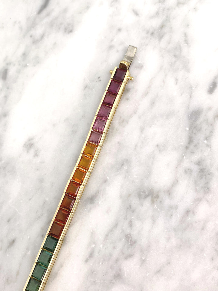 Luxurious tennis bracelet with tourmalines, citrines and topazes in gold: "Joy of the Rainbow"
